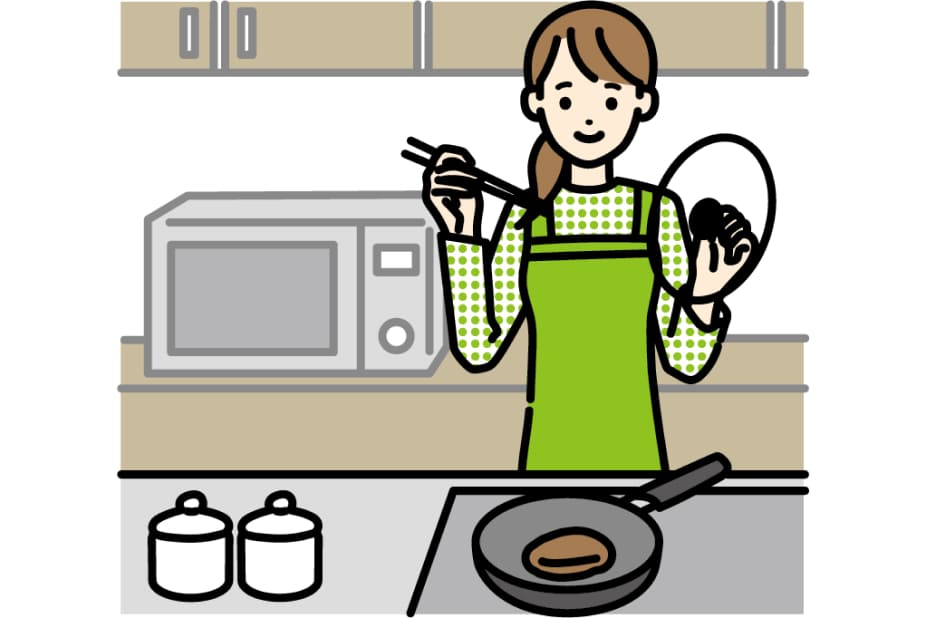 料理中の女性の写真